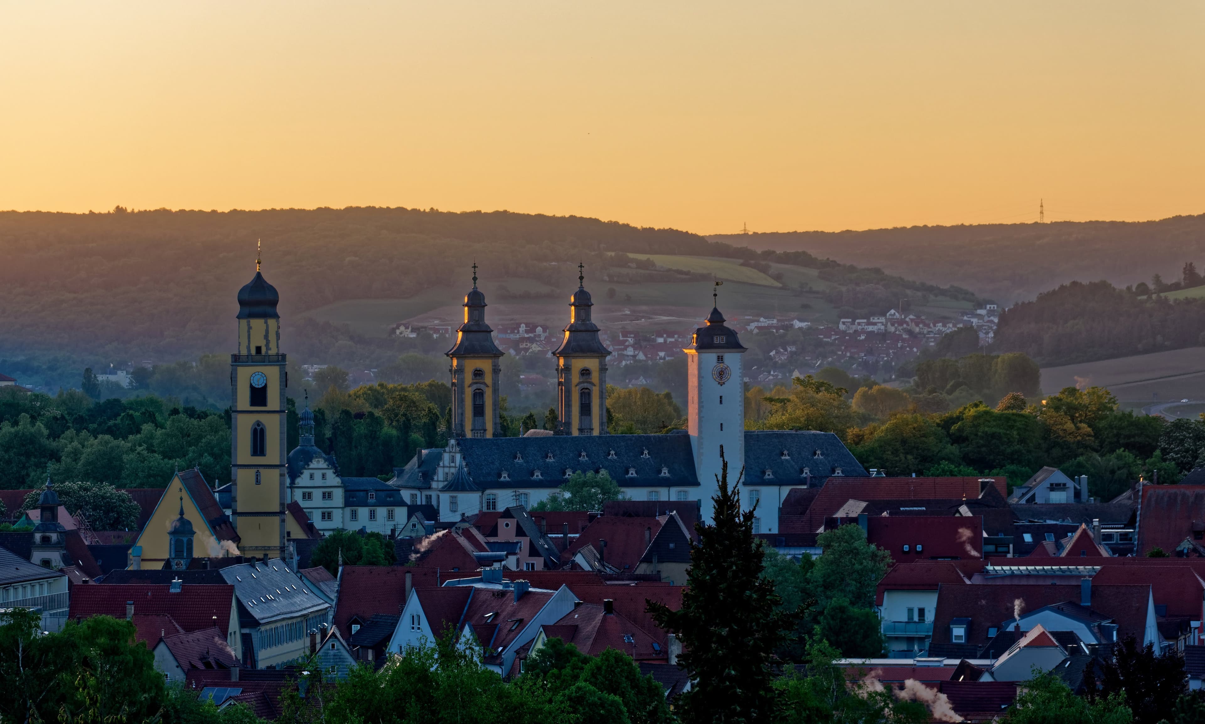 The towers of the castle church, the castle and the minster after sunrise
