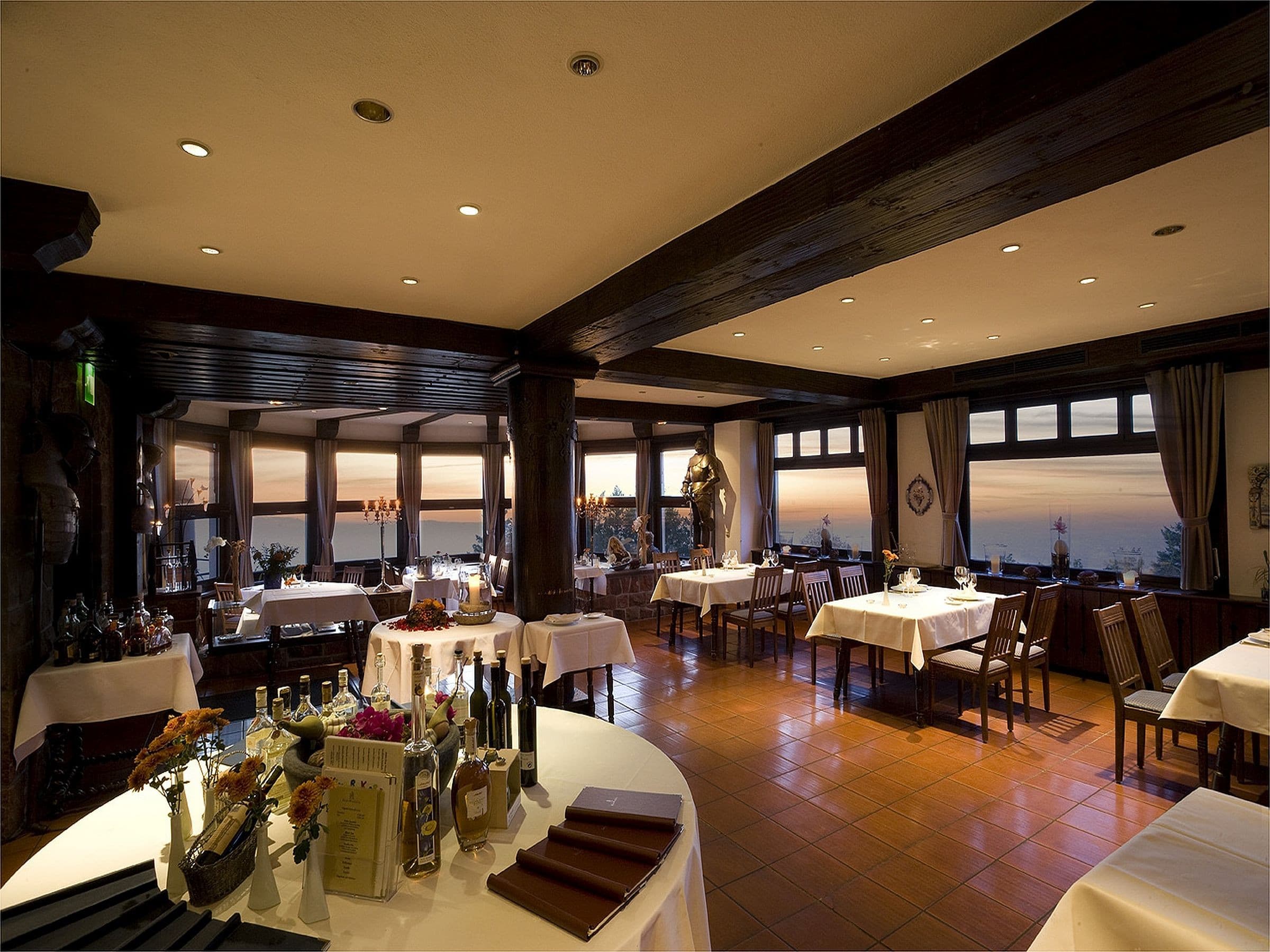 Interior view of Hotel and Restaurant Burg Windeck with sunset in the background
