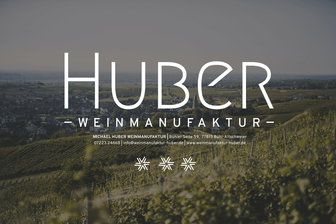 View over vines with the Huber Weinmanufaktur logo